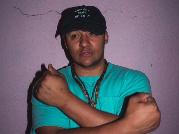 Confident man standing in a dynamic pose indoors