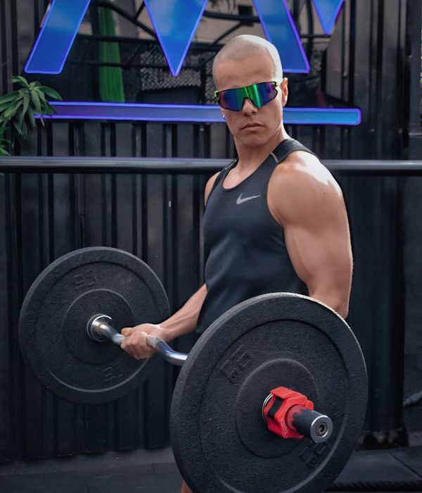 Man performing physical exercises for energy and tone indoors